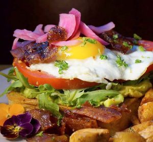 Avocado toast with seasonal organic garden greens and veggies are a favorite at Sunny Point Cafe in Asheville, NC