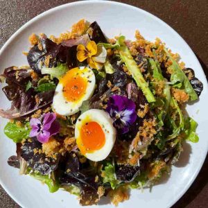 Hyper-local greens and garnishes on this healthy salad by Sunny Point Cafe in Asheville, NC