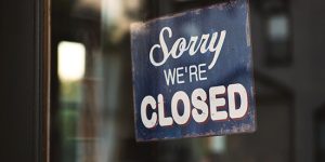 Sign showing sorry we're closed, demonstrating the urgency to support and prevent more local indie restaurants from closing.